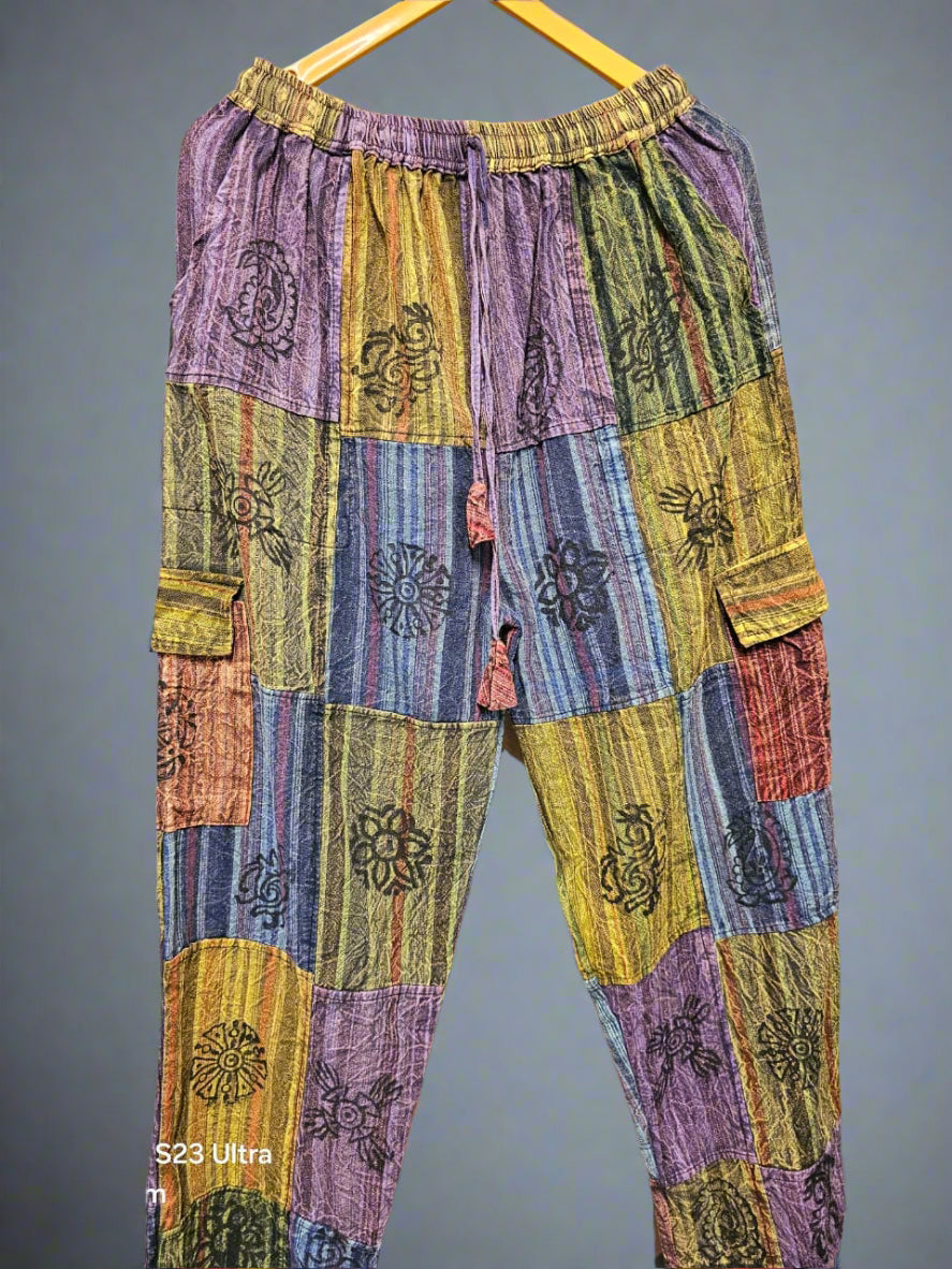 Colorful patchwork pants with floral patterns on a zigzag background